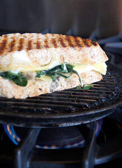 Artichoke and spinach grilled cheese sandwich, on grill